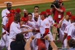 Carlos Ruize mobbed by teammates after winning home run.